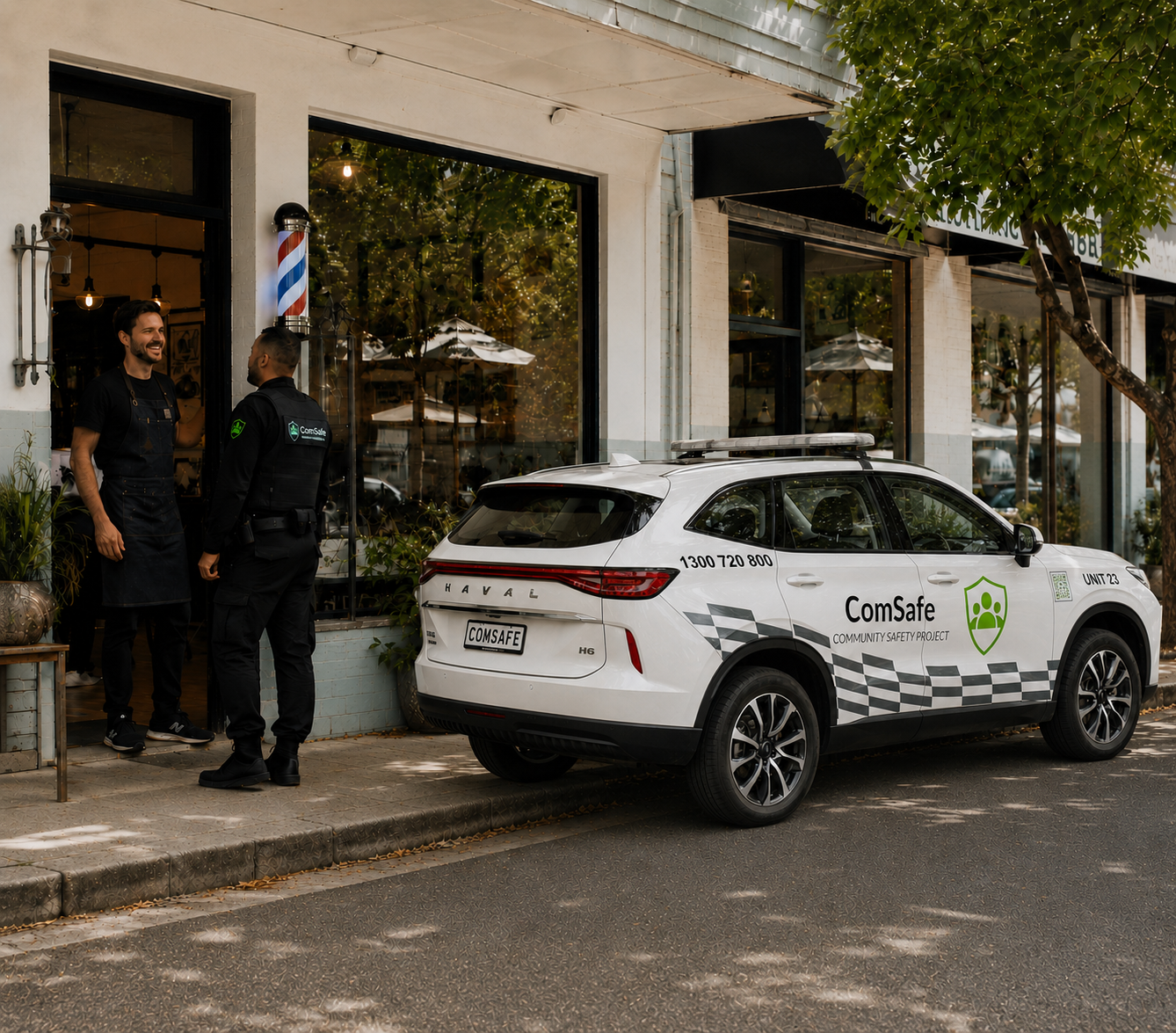 Two uniformed men chat at the storefront entrance as a white ComSafe safety SUV is parked on the curb outside.